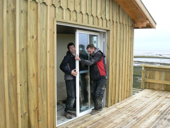 Baie vitrée à galandage 1 vantail, installation dans une maison à ossarure bois