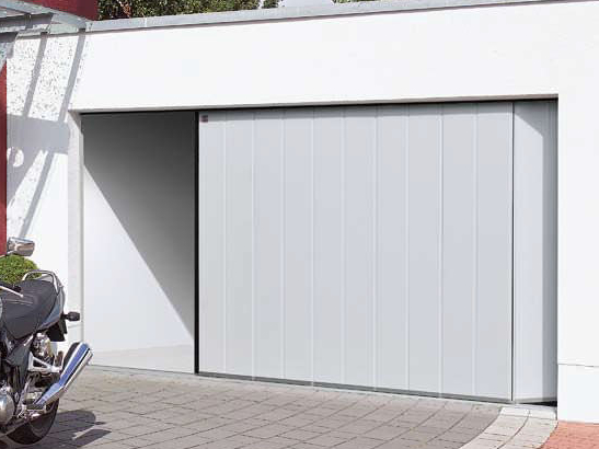 Porte de garage sectionnelle latérale avec isolation périphérique, joints mousse